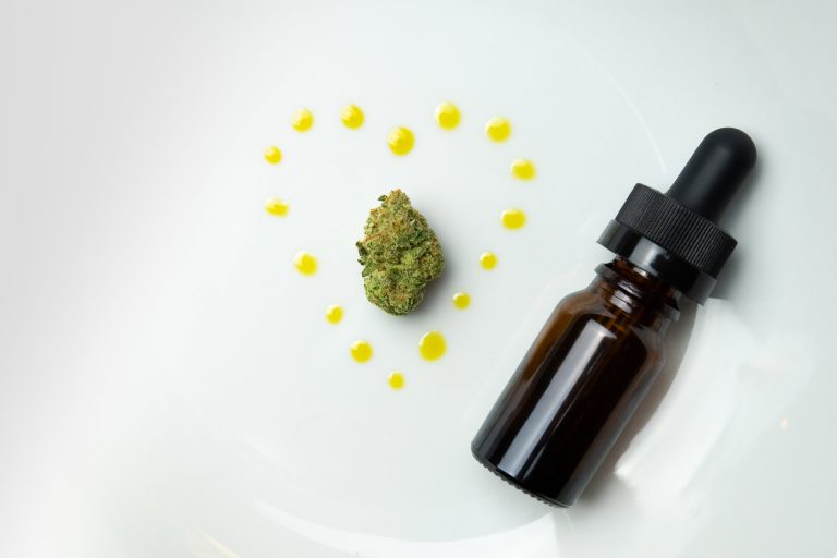 Cannabis Nug Oil Heart Bottle on Plate